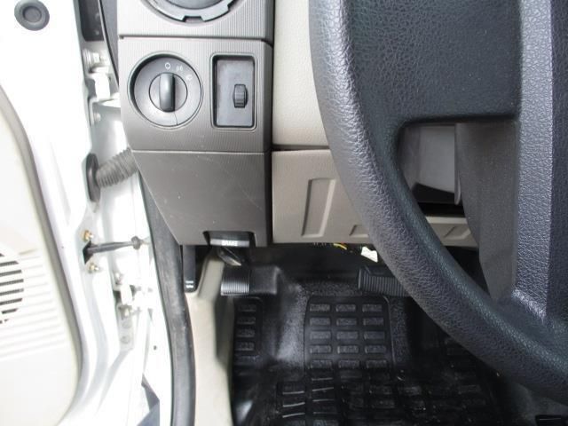 A close up of a car dashboard with a steering wheel