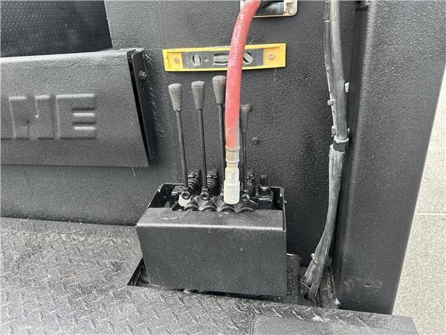 A hose is attached to a machine that has the word ne on it