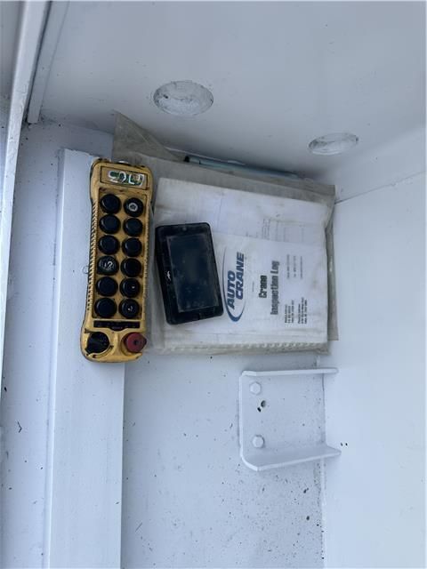 A yellow remote control with the word auto on it