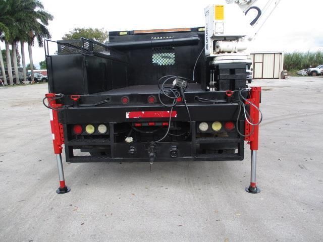 The back of a truck with a crane attached to it