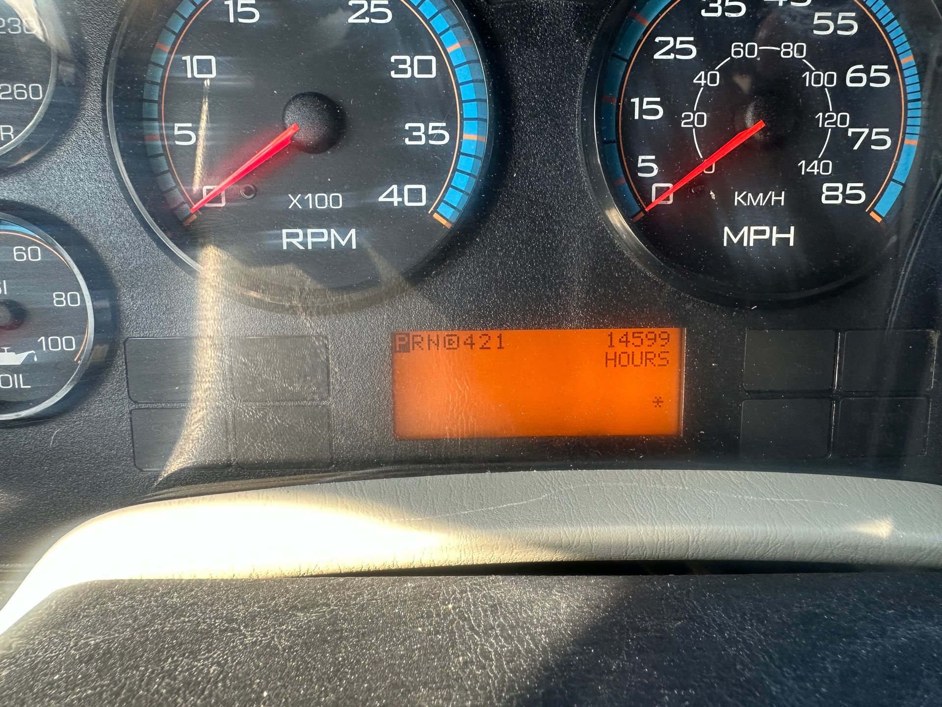 A close up of a dashboard with rpm and mph displayed