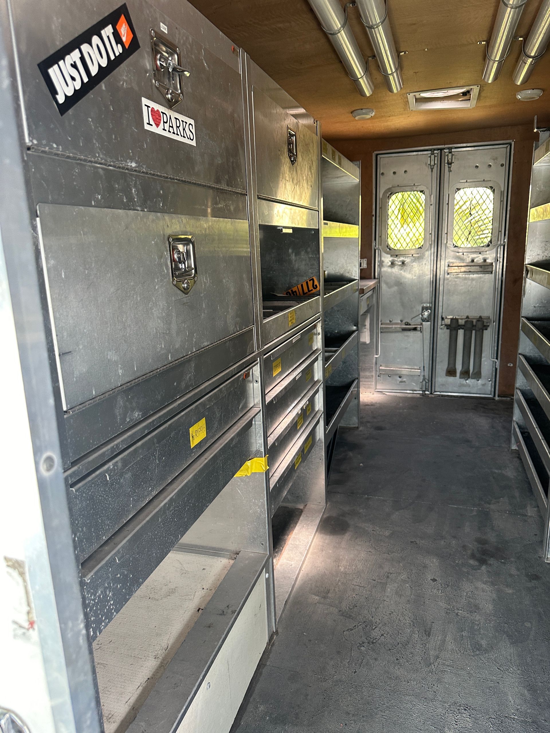 The inside of a van with a sticker that says just do it