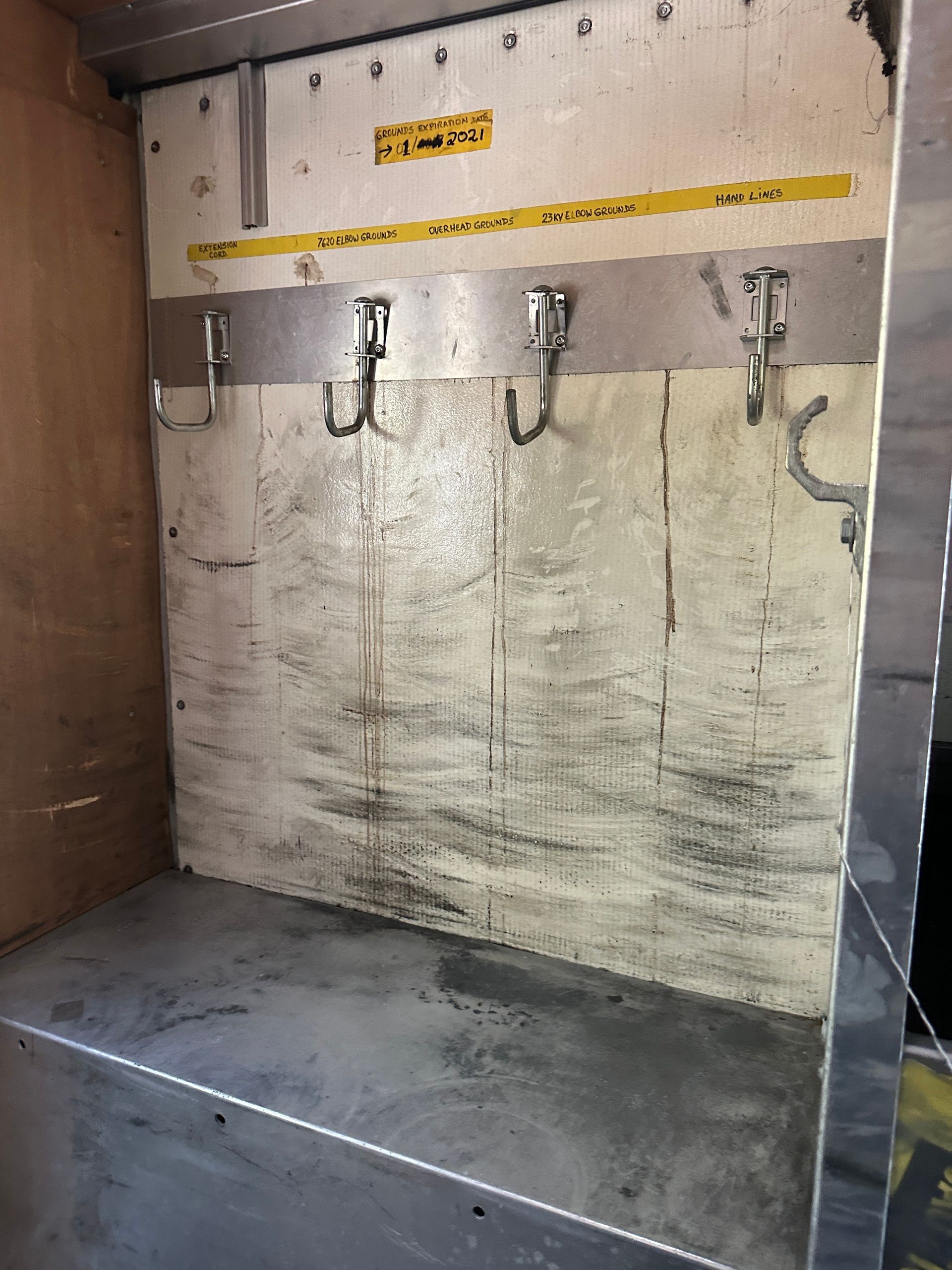 A wall with hooks on it