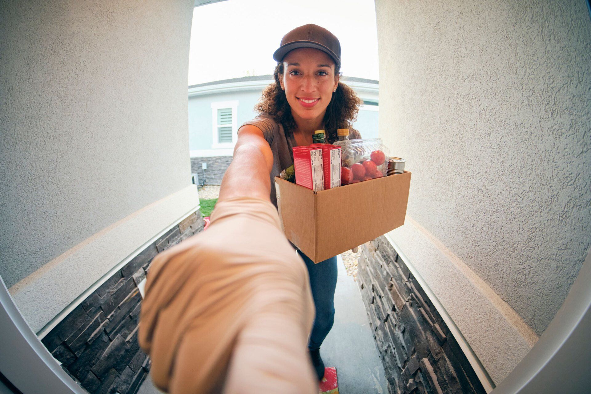Woman Delivering Groceries — Geelong, VIC — John Scarlett Security Pty Ltd