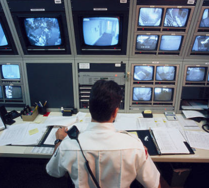 Security Guard Monitoring Multiple CCTV Footage — Geelong, VIC — John Scarlett Security Pty Ltd