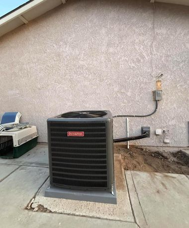 Outdoor HVAC unit beside a stucco house wall on a concrete pad, with exposed dirt and utility lines nearby