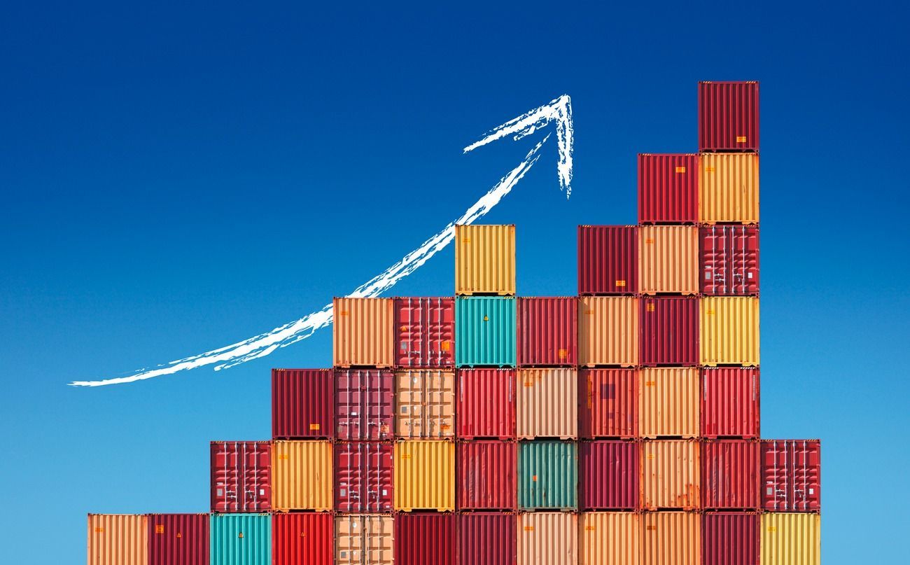 A stack of shipping containers with an arrow pointing up.