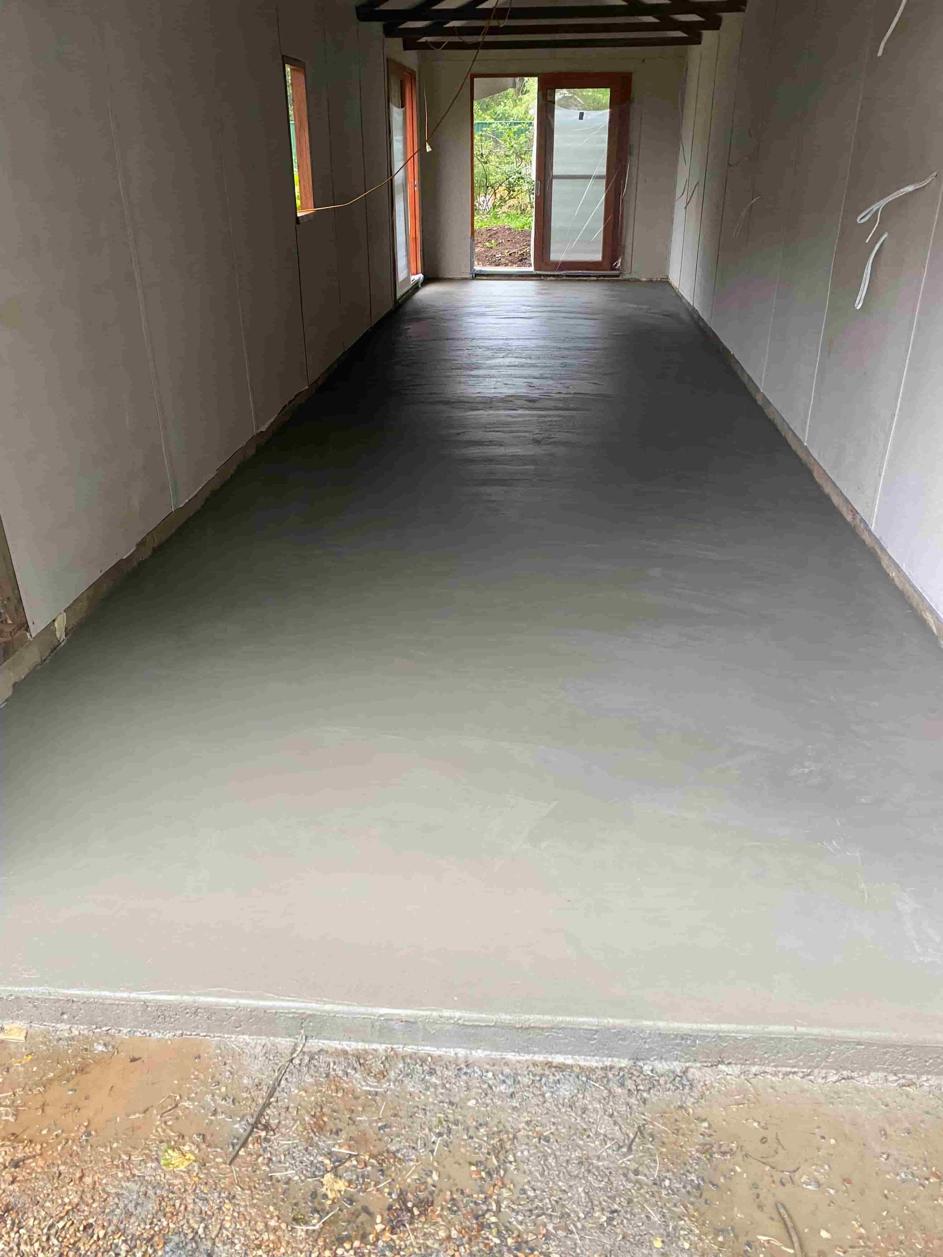Long, Narrow Room With Fresh, Smooth Concrete Floor — Shaka Concreting In South Golden Beach, NSW