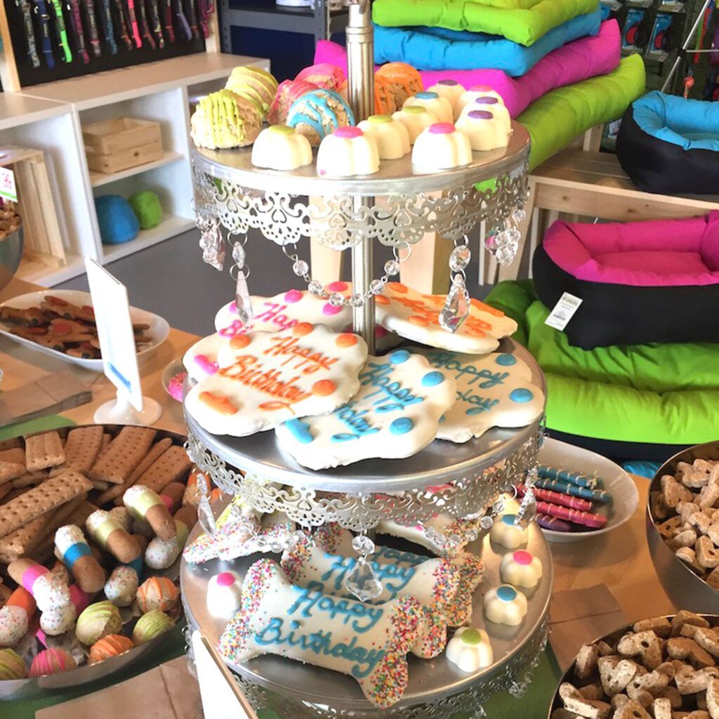 A stack of cupcakes with the words `` happy birthday '' written on them