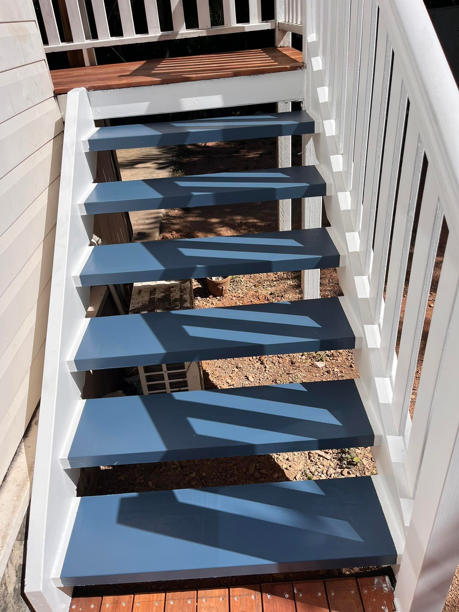 Person Spray Painting Stringer — Shaun Steenson Building Services in Townsville, QLD