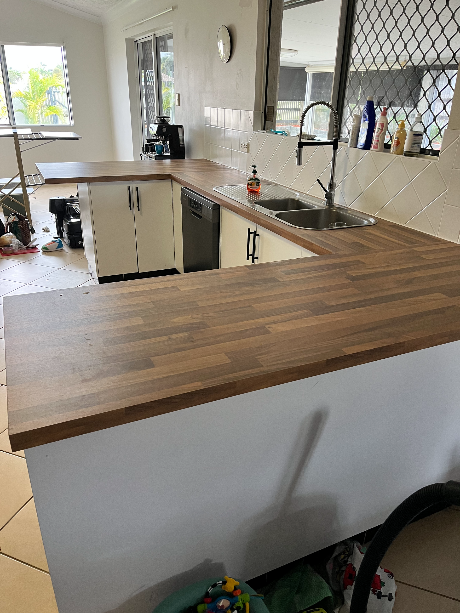 A Set of White Stairs With a Wooden Railing — Shaun Steenson Building Services in Townsville, QLD