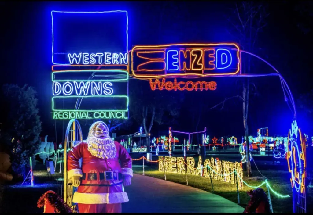 Enzed neon sign in Christmas display filled park