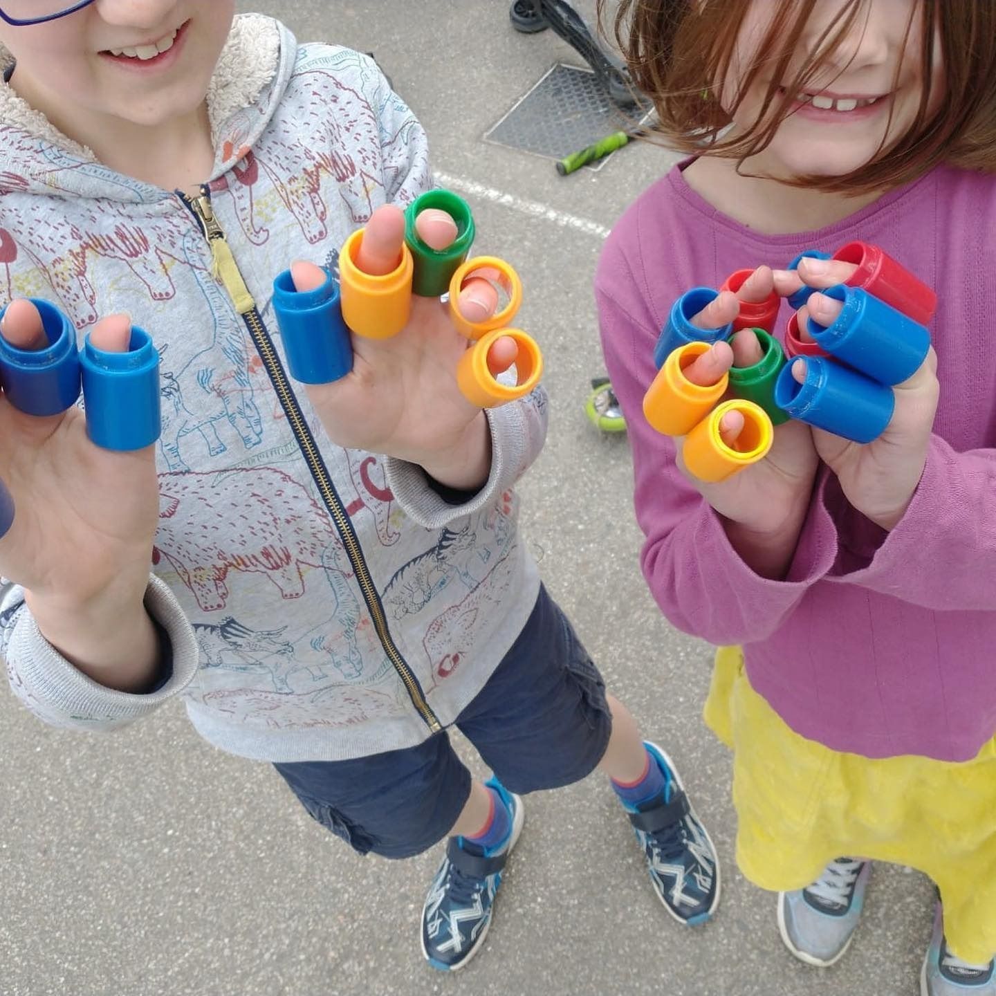 Play-Doh set with blue tray, rolling pin, various cutters, and colorful play-doh pieces on a wooden surface.
