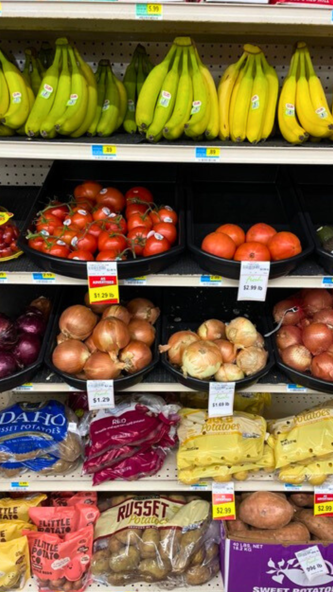 A bunch of tomatoes are stacked on top of each other