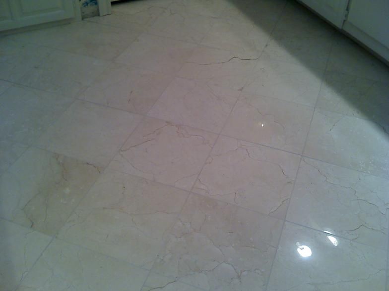 Light beige marble tile floor.