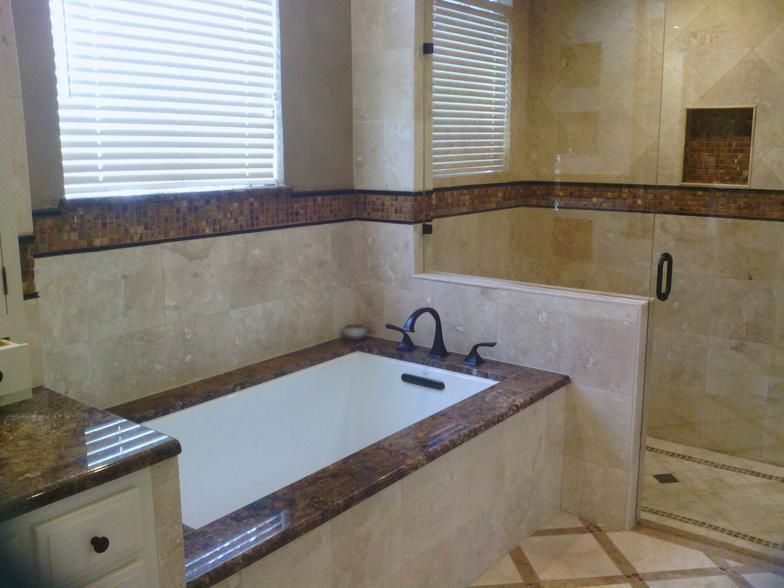 After: Travertine and new tub and custom built shower