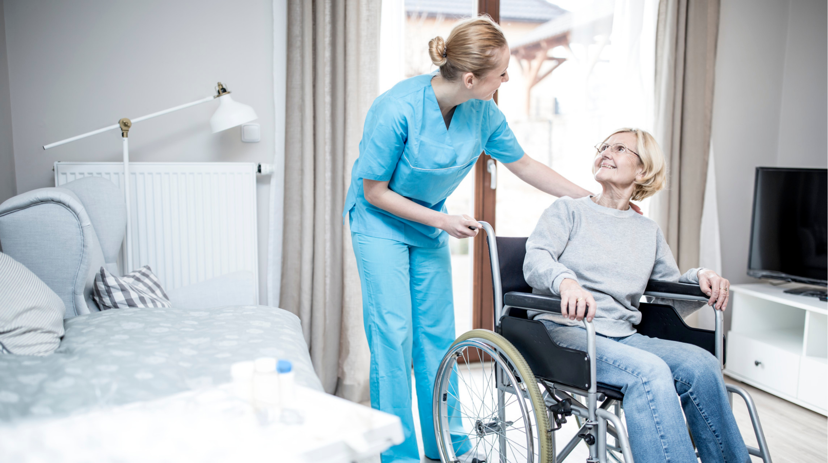 a woman in a wheelchair is being helped by a nurse, Angel Leaf Home Care Provider
