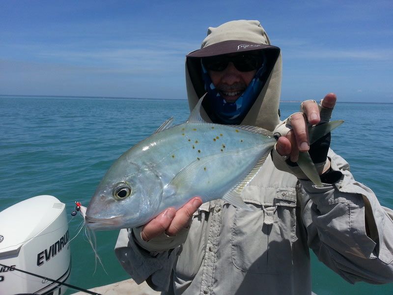 Man carrying fish 4 — Dean Jackson Guided Tours in Winnellie, NT