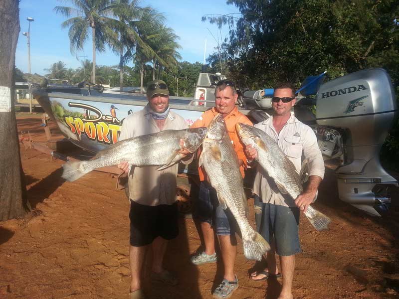 Three men carrying their big fish — Dean Jackson Guided Tours in Winnellie, NT