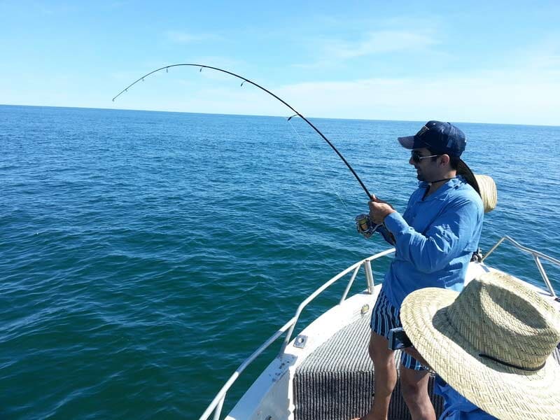 Woman fishing — Dean Jackson Guided Tours in Winnellie, NT