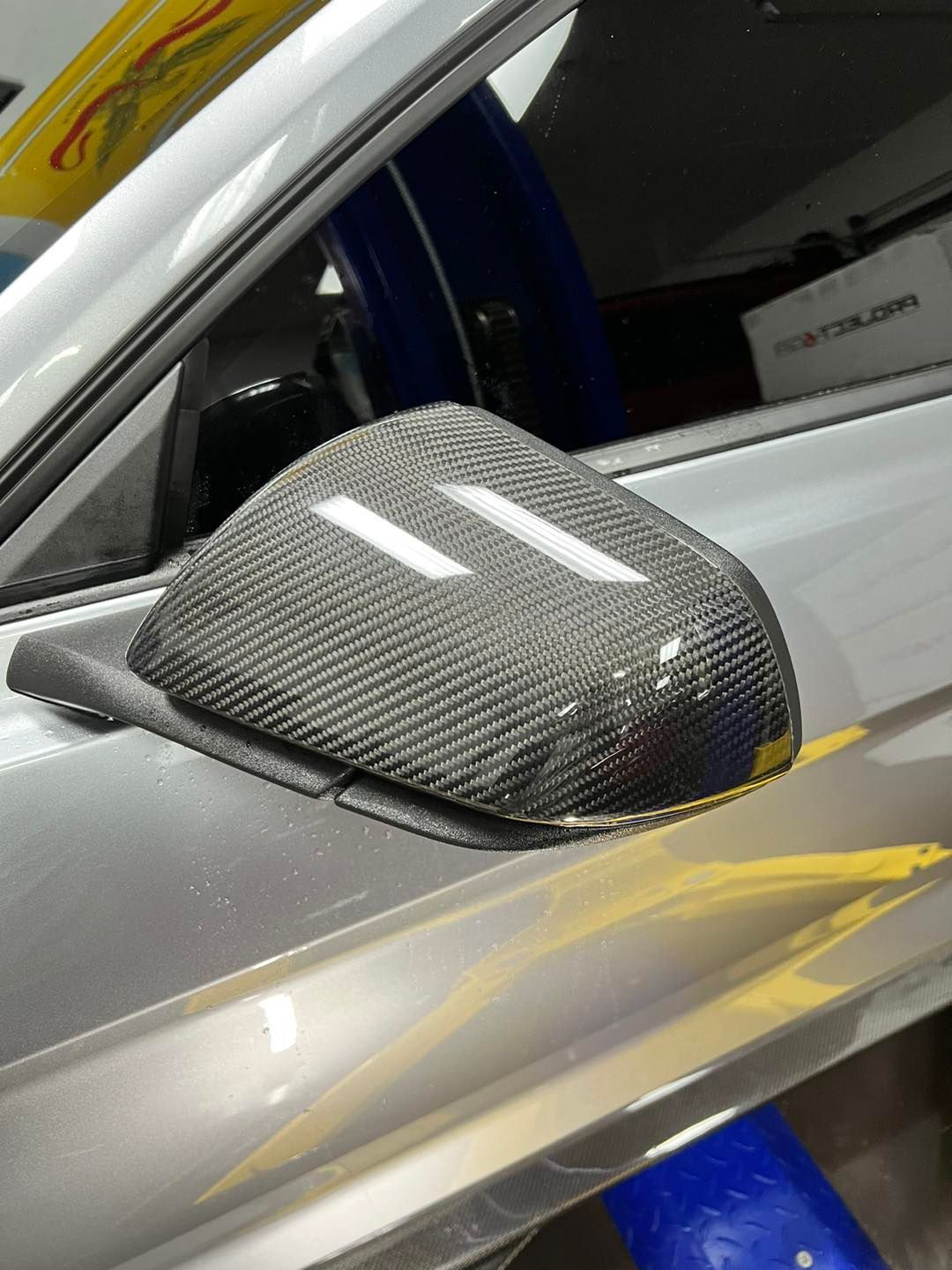 A close up of a side view mirror on a car