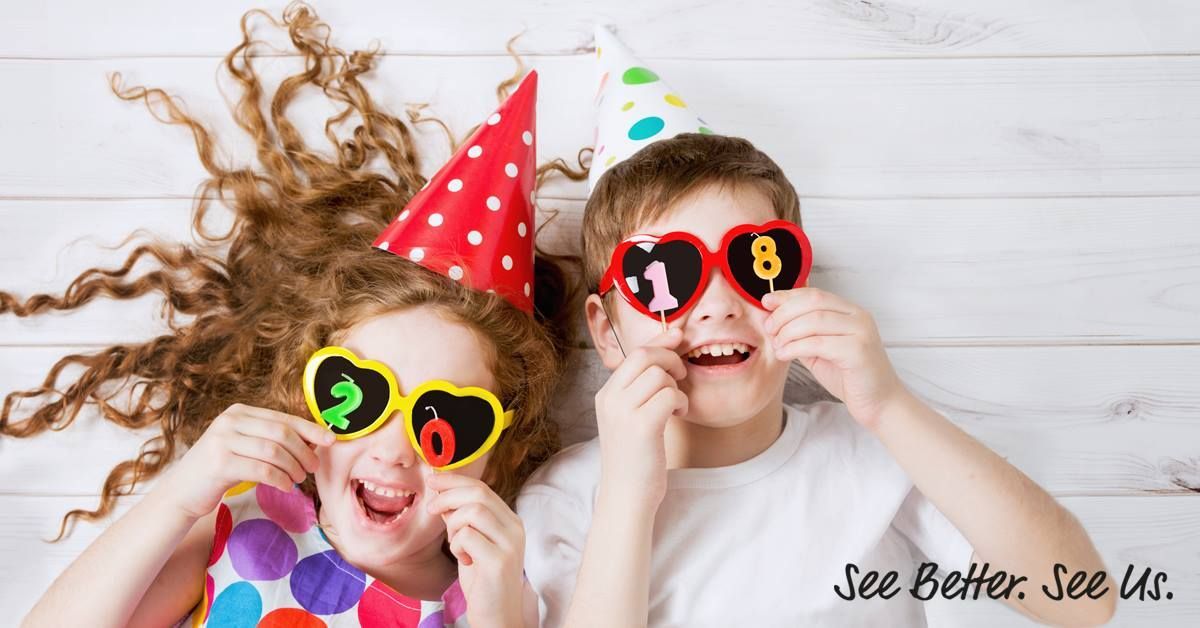 A Boy and a Girl Wearing Party Hats and Sunglasses Are Laying on the Floor — Ian Emslie Optometrist In Warners Bay, NSW