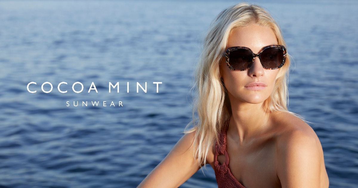 A Woman Wearing Sunglasses is Sitting in the Water — Ian Emslie Optometrist In Warners Bay, NSW