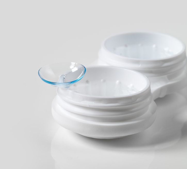 A Pair of Contact Lenses in a White Container on a Table — Ian Emslie Optometrist In Warners Bay, NSW
