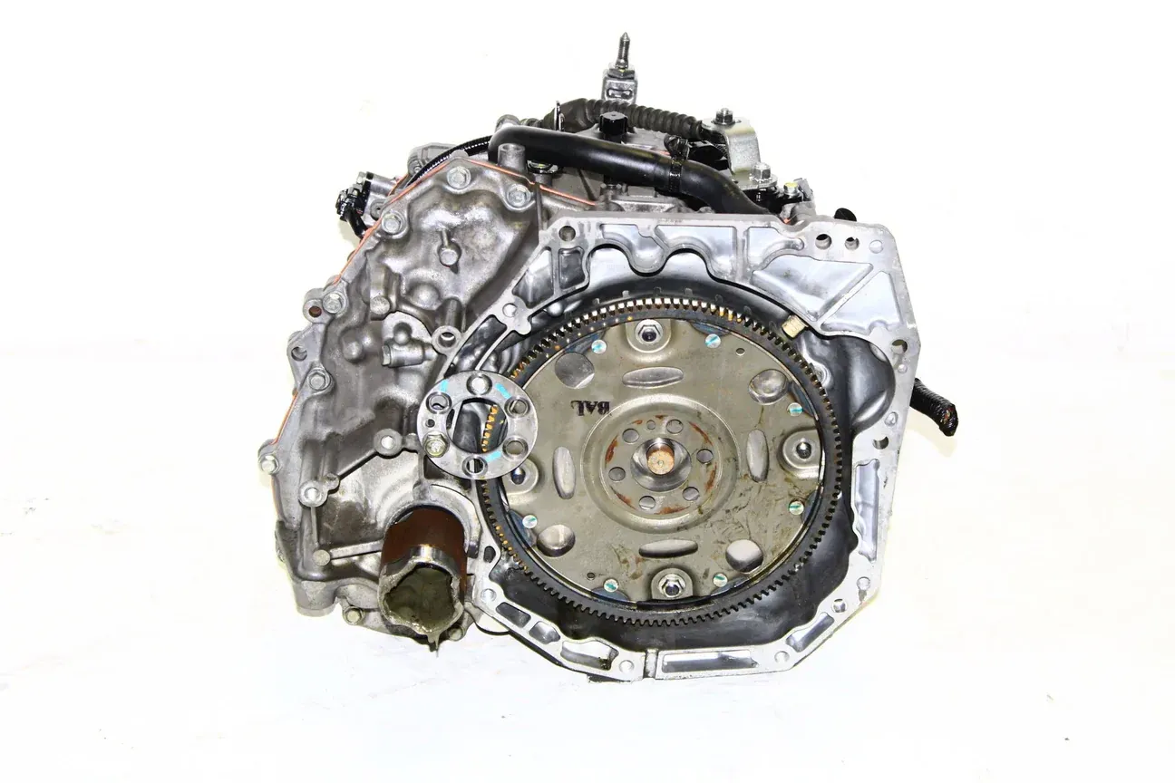 A clean, silver-colored automotive transmission component viewed from the side against a white background.
