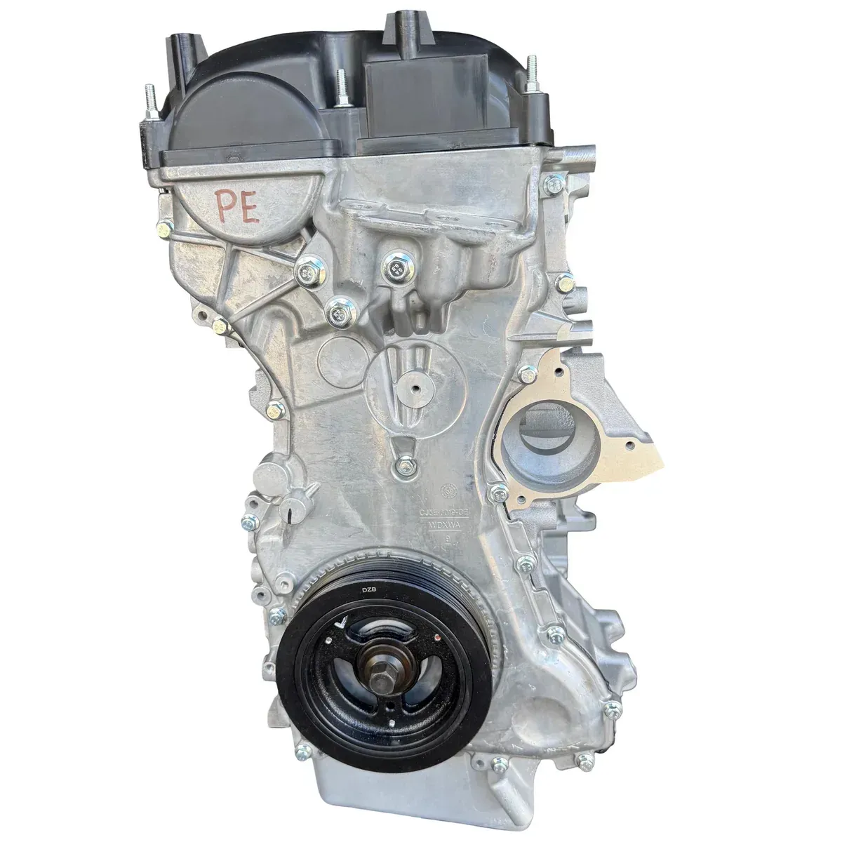 A silver, cast-aluminum automotive engine block showing the side profile, intake ports, and a black harmonic balancer pulley.