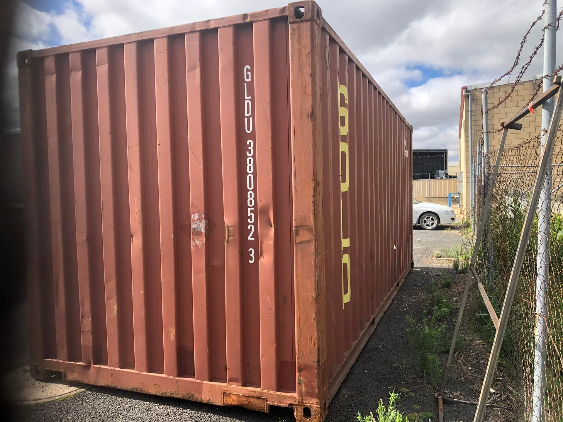 A brown shipping container with the word cargo on it