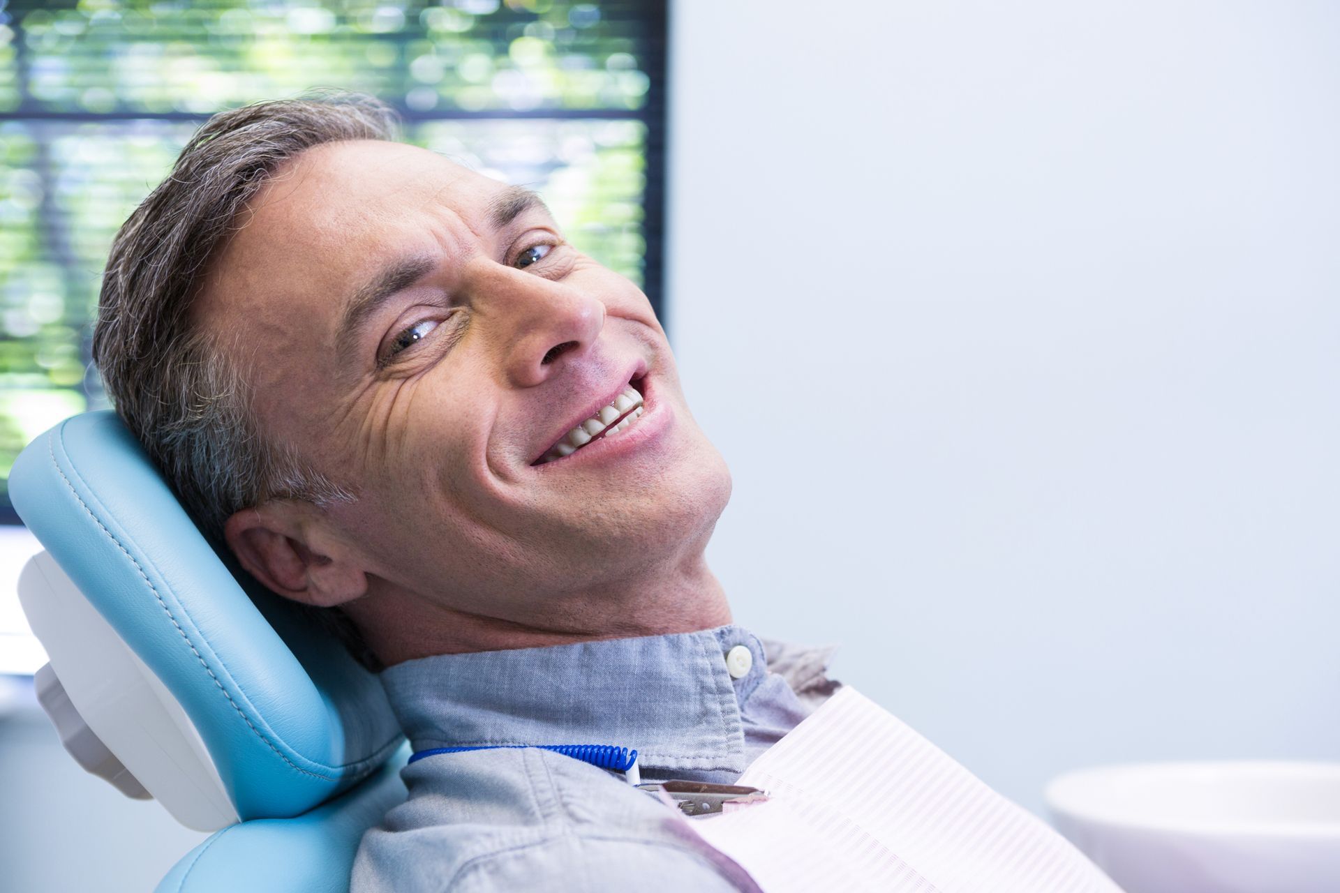 Man smiling at dentist | patient centric care at best family dental spa in Hunt Valley MD