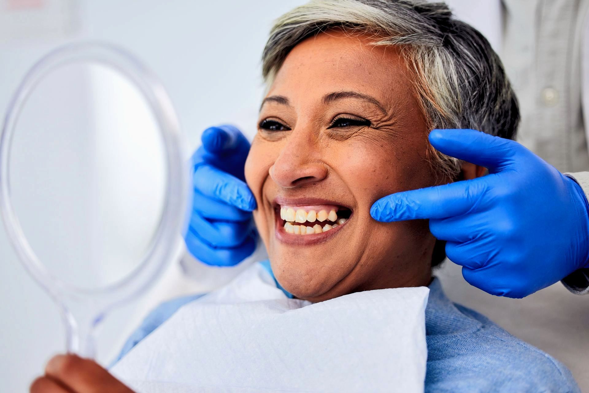 woman smiling at dental office | restorative dentist in hunt Valley MD