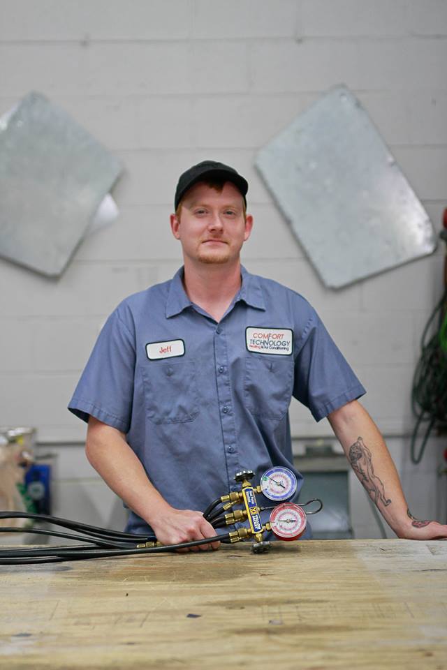 Air Cleaner — Mechanic Holding Air Pressure Tool In Hampton, VA