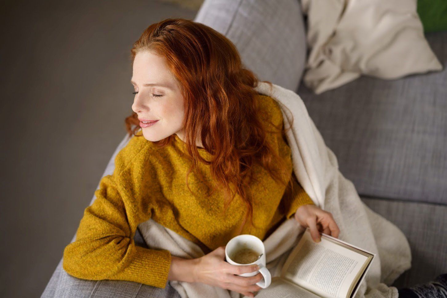 Woman Sitting While Holding a Cup of Coffee — Hampton, VA — Comfort Technology