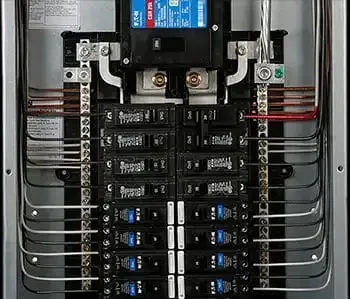 Electrical panel with multiple circuit breakers and wiring.