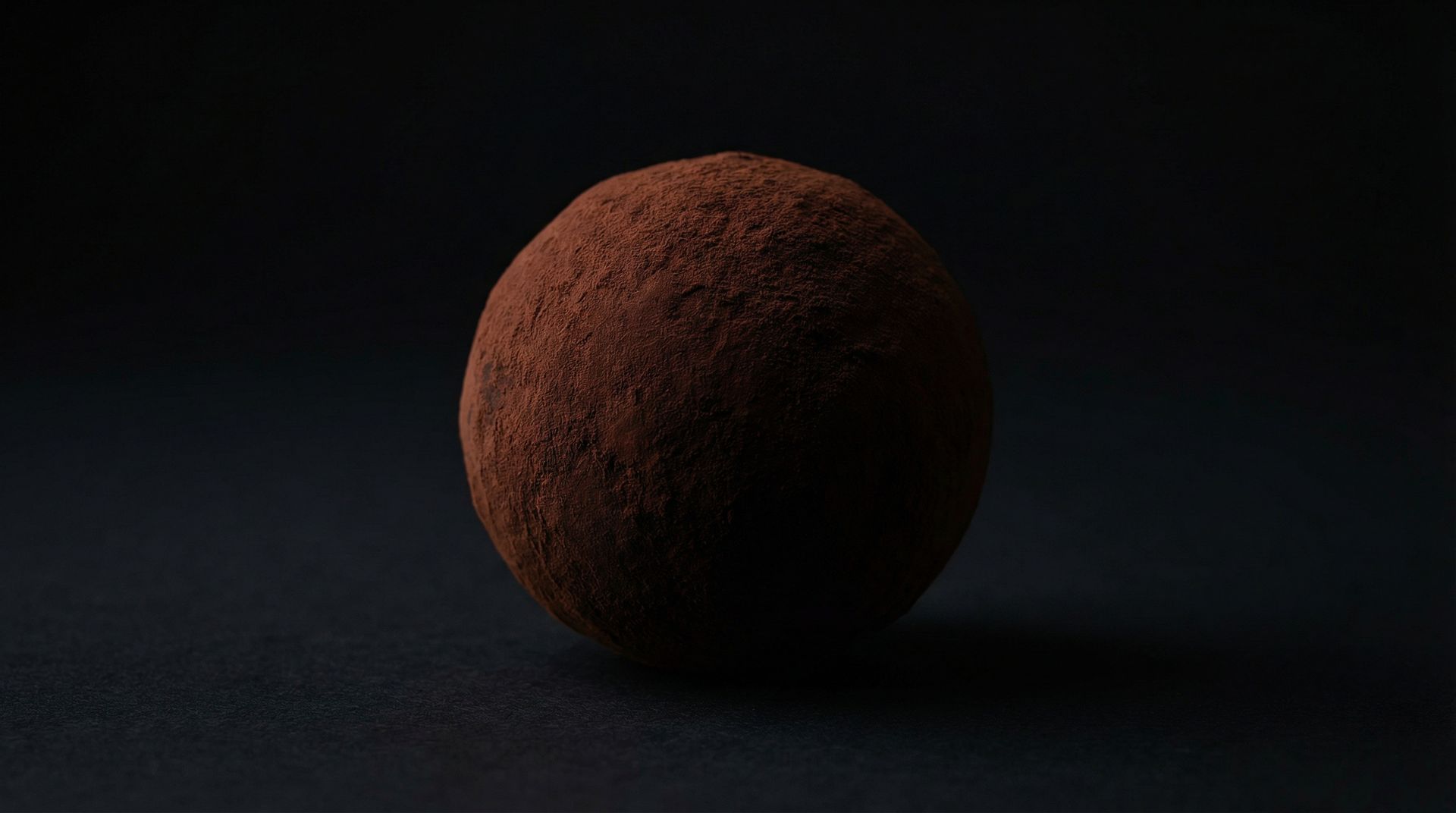 Dark chocolate truffle coated in cocoa powder