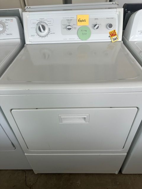 A white washer and dryer with a yellow sticker that says 4 cents