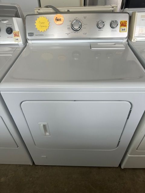 A white dryer with a sale sign on it