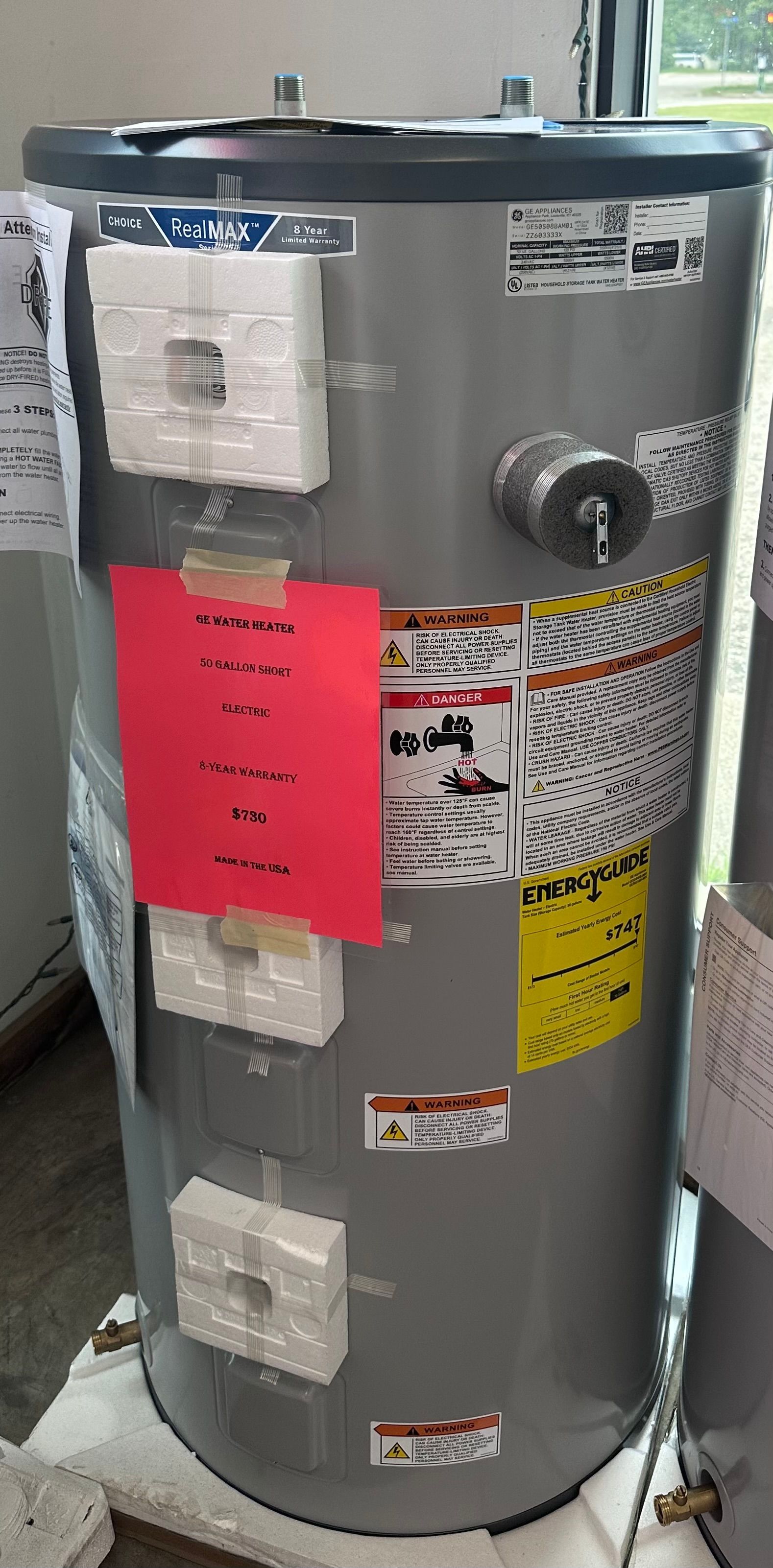 A large gray water heater is sitting on top of a table.
