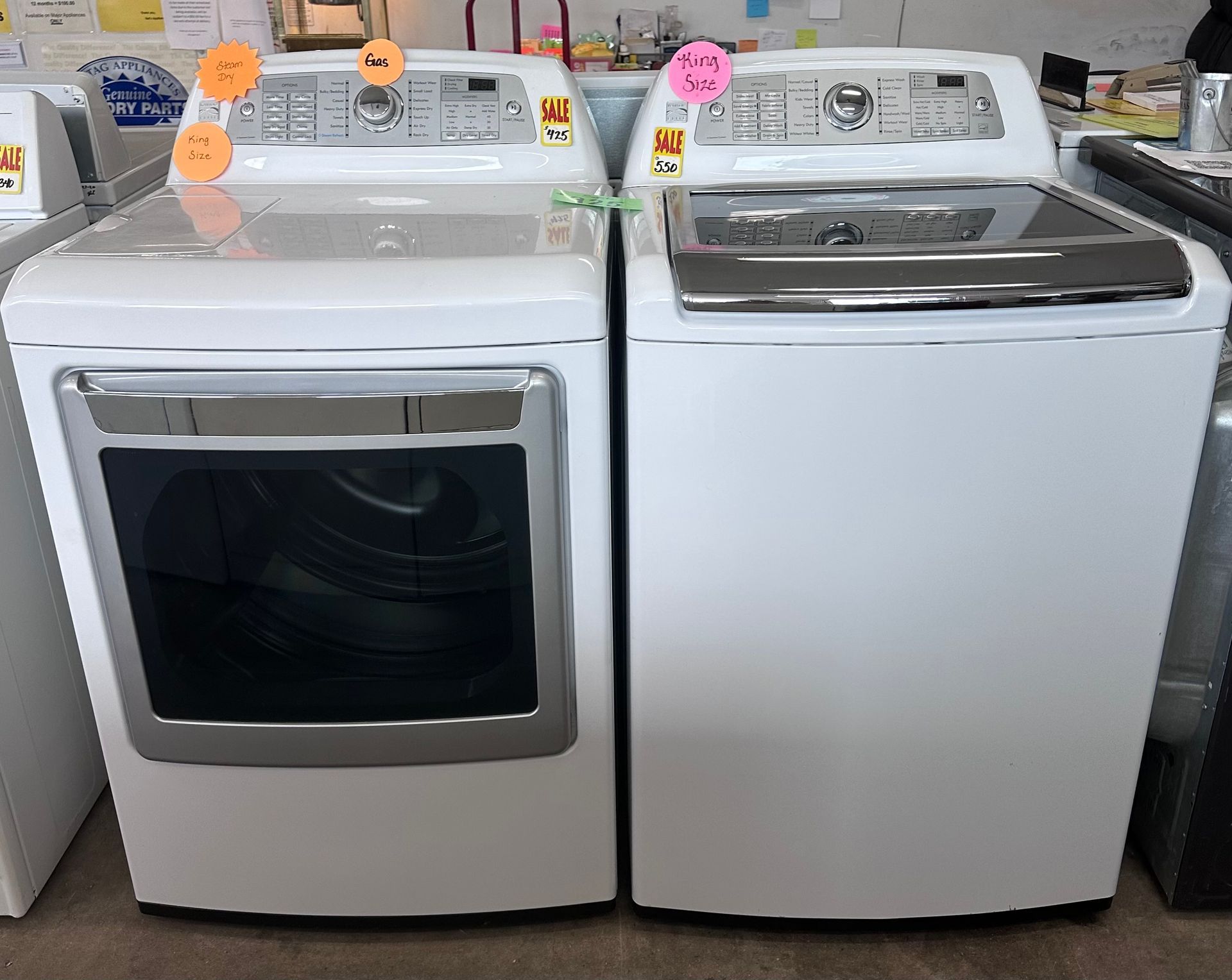A washer and dryer are sitting next to each other in a room.