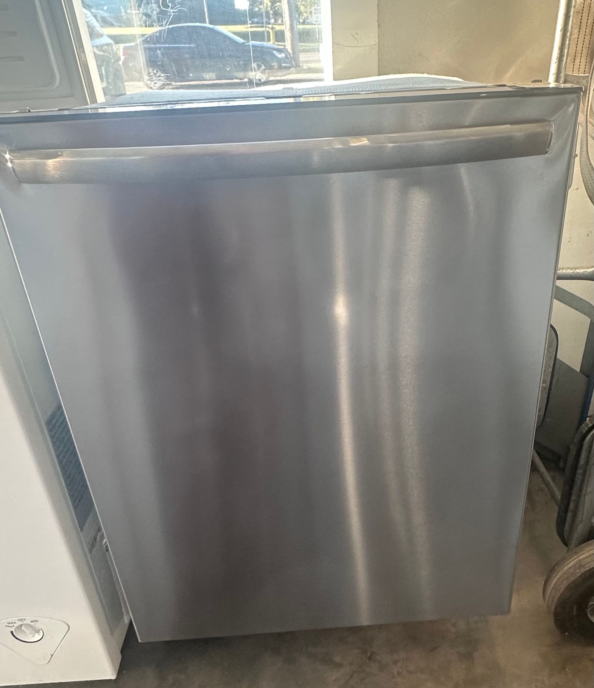 Stainless steel dishwasher with a horizontal handle.