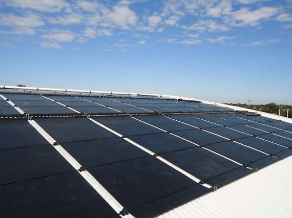 A roof with a lot of solar panels on it