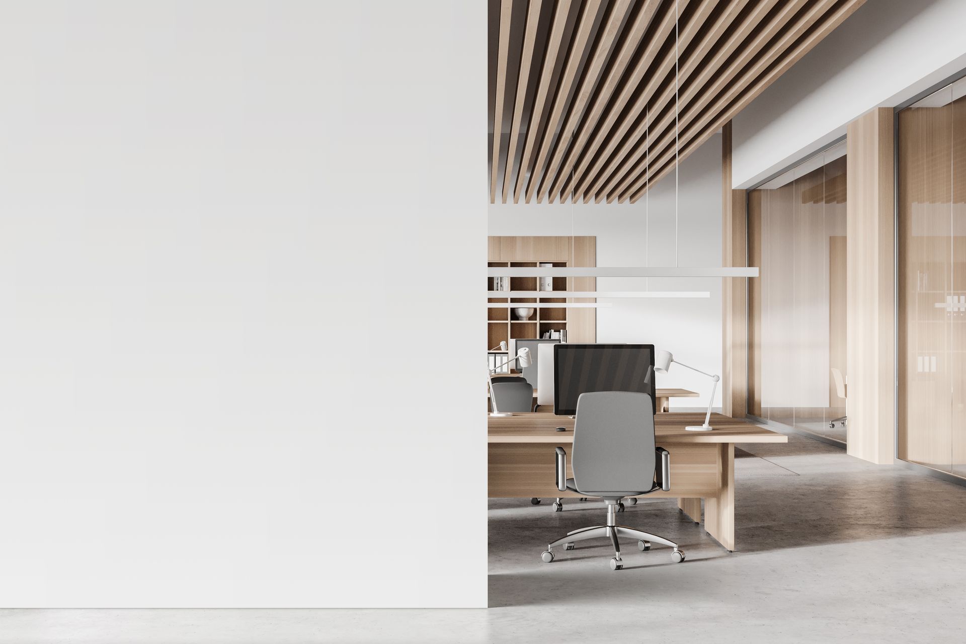 Modern open office with wood ceiling slats and minimal workstations.