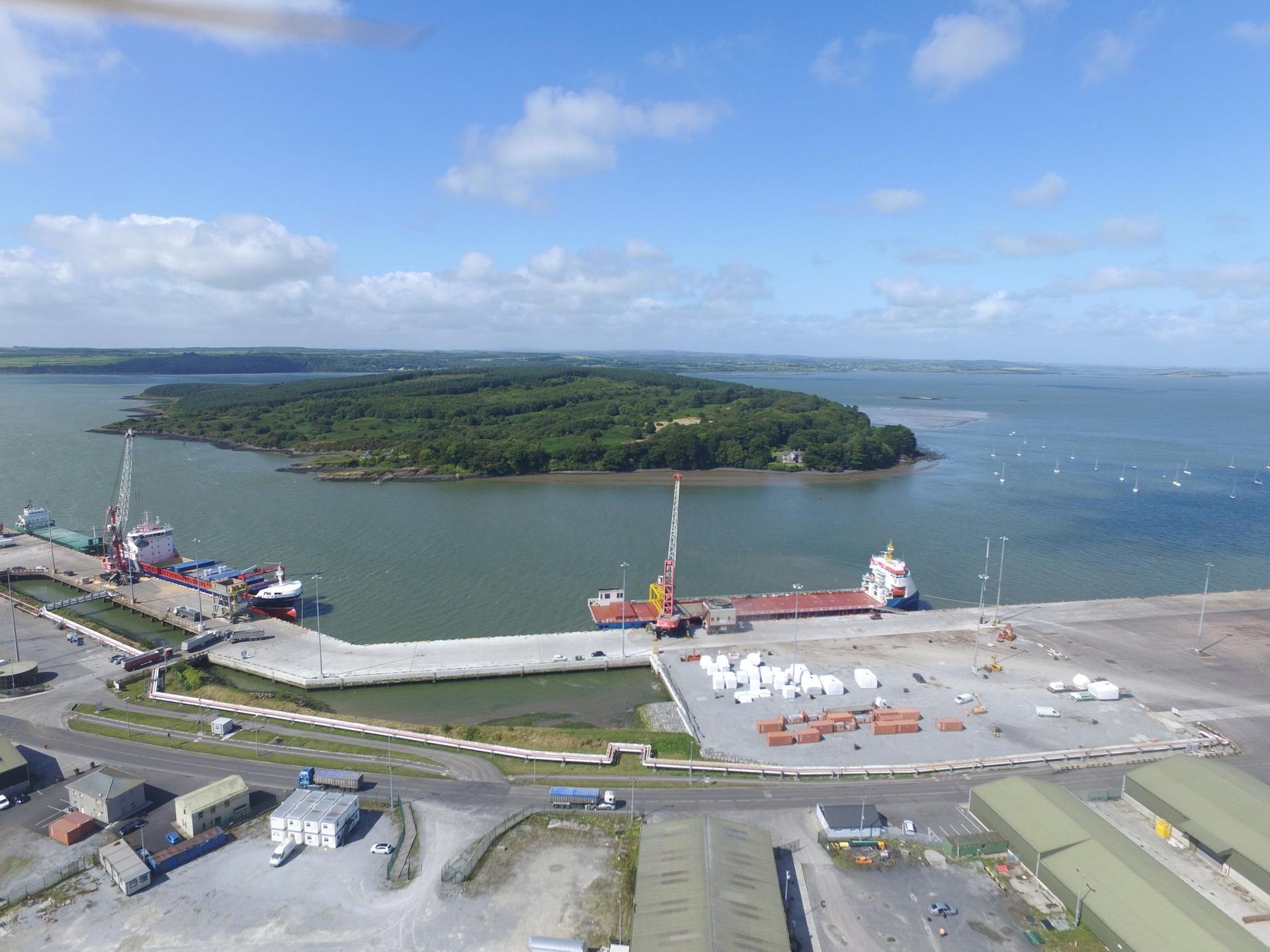 A large body of water with a small island in the middle