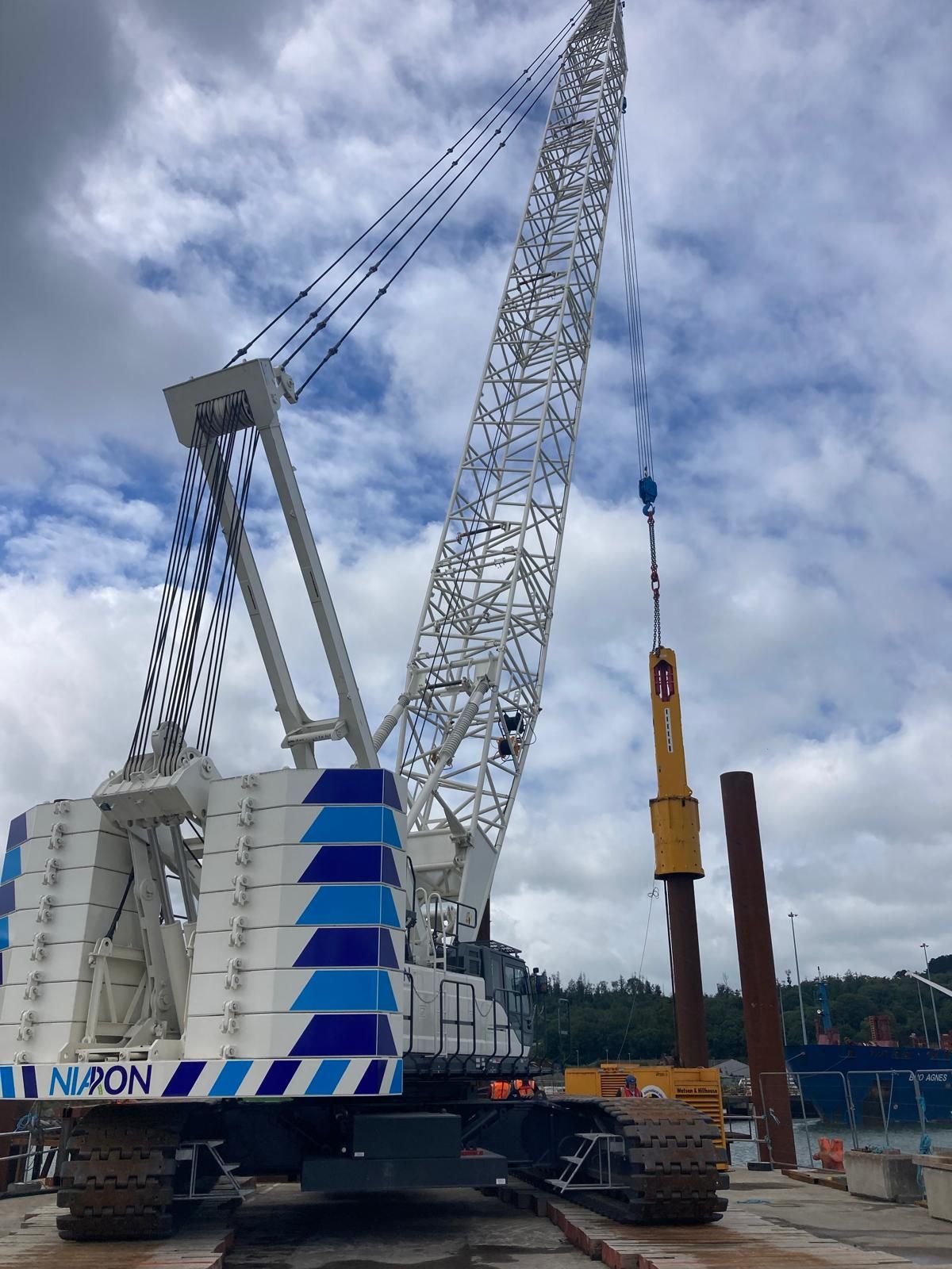 A large crane with the word amon on the side