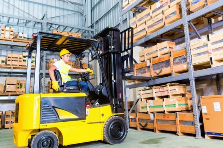 Man working a forklift in shop