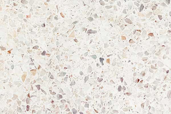 A close up of a white terrazzo floor texture.