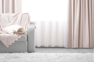 A living room with a couch and a book on it.