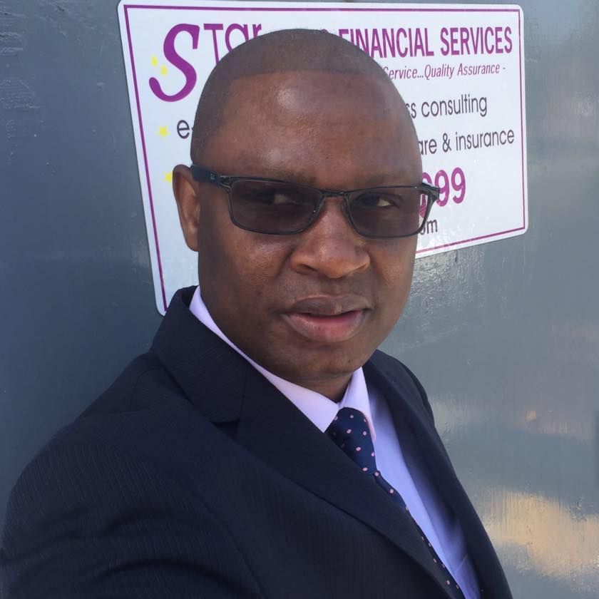 A man wearing a mask is shopping in a grocery store.